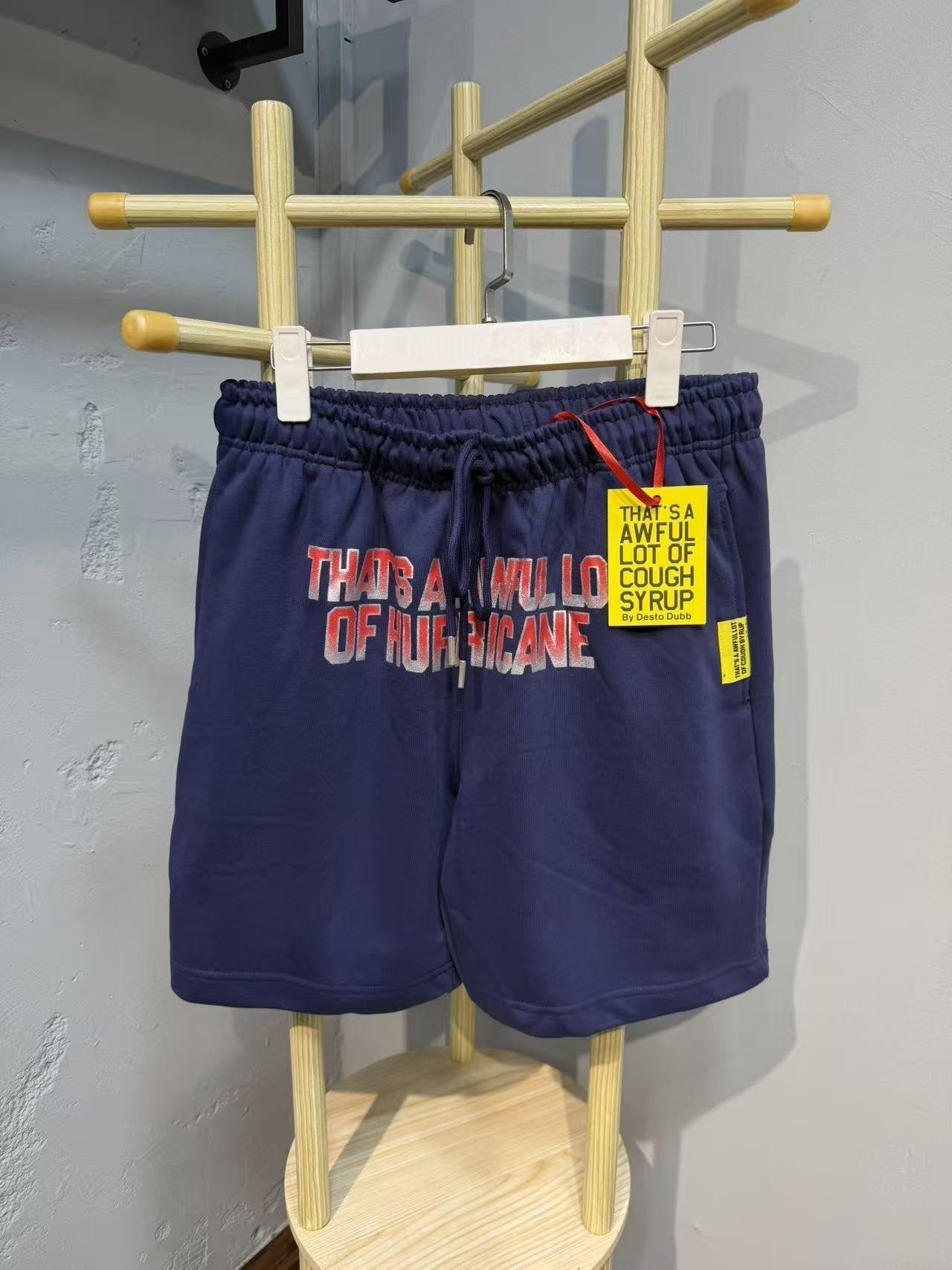 THAT'S A AWFUL LOT OF COUGH SYRUP Navy Graphic Shorts — front