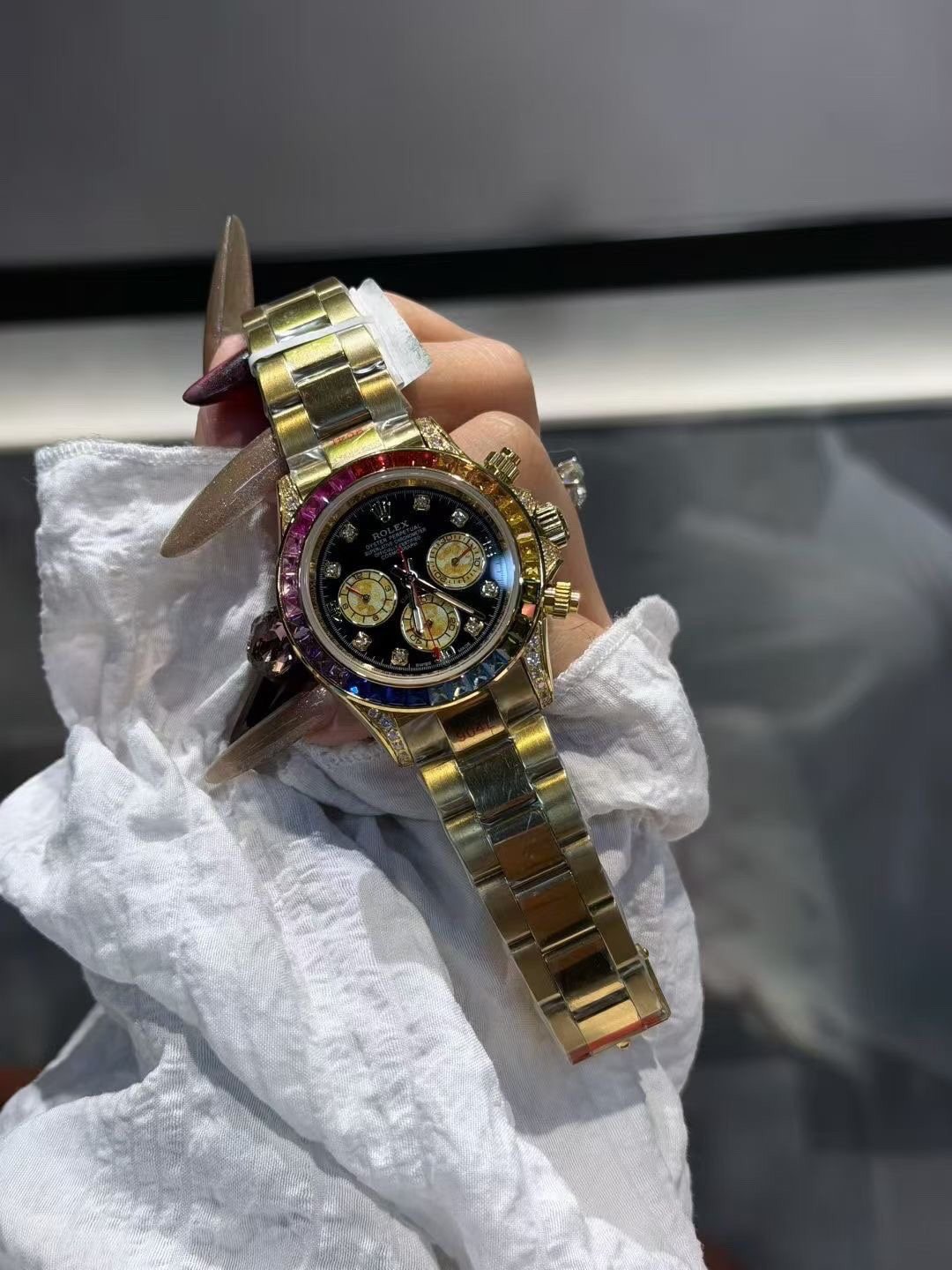 Rolex Rainbow Gemstone Chronograph Watch — front
