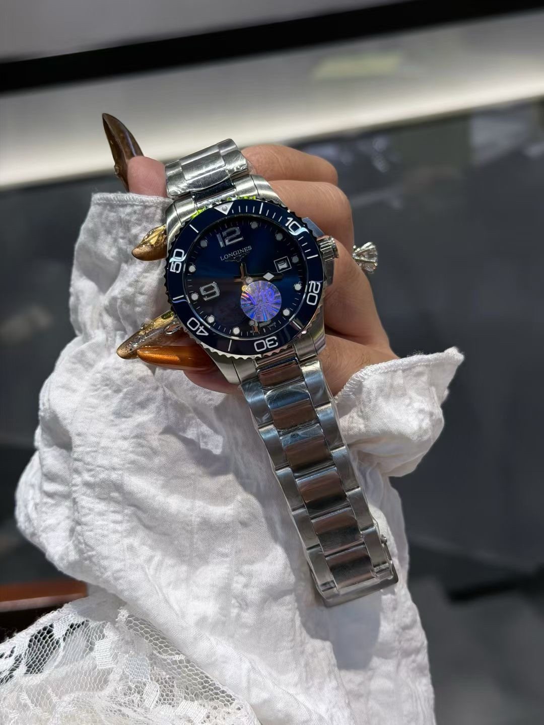Longines Blue Bezel Link Bracelet Watch — front