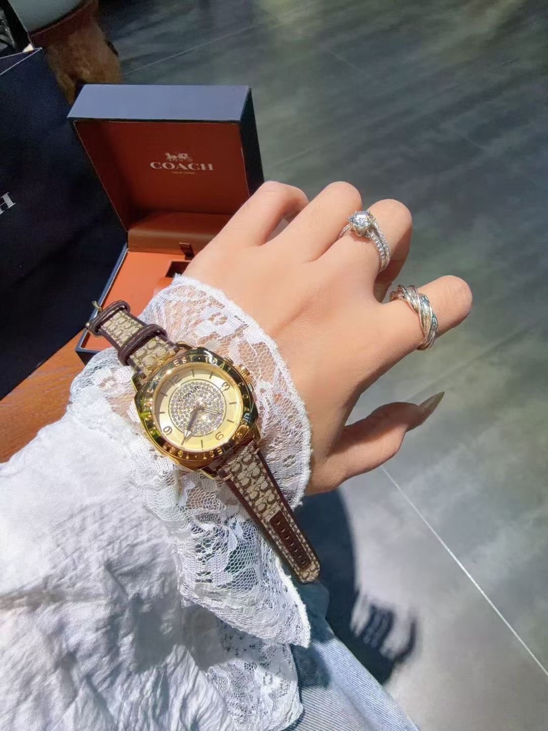 Coach Gold-Tone Patterned Strap Watch — model