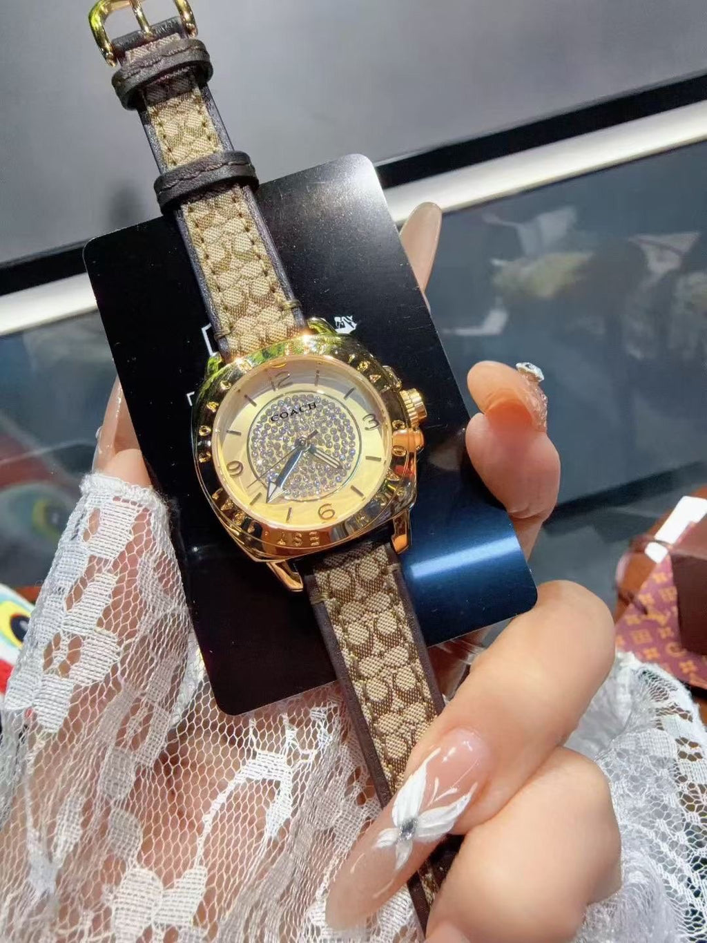 Coach Gold-Tone Patterned Strap Watch — hero