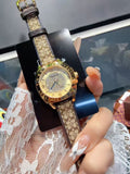Coach Gold-Tone Patterned Strap Watch — hero